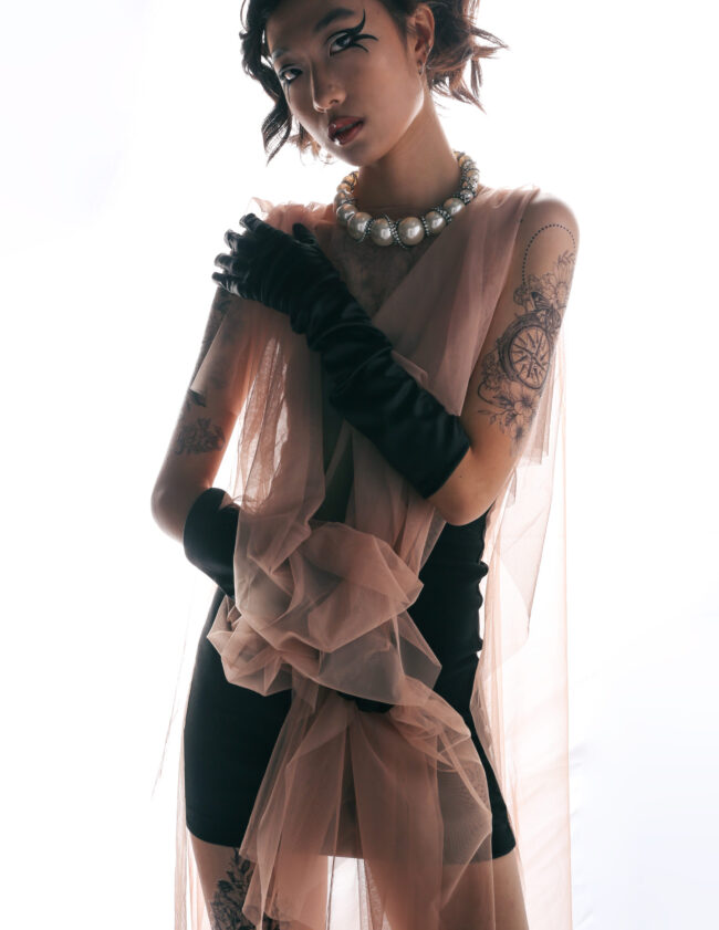 girl in a pink dress with a flowery scarf