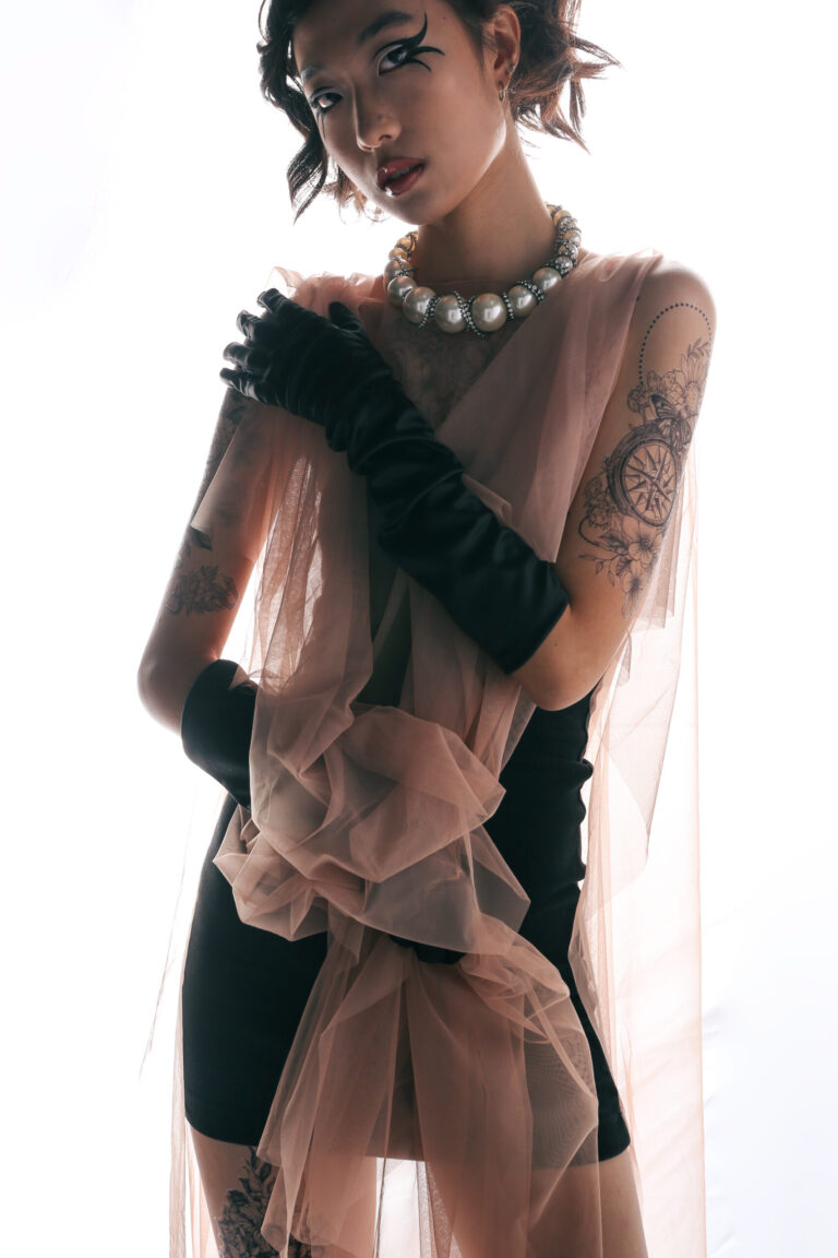 girl in a pink dress with a flowery scarf