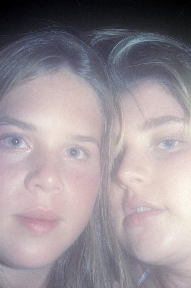 Mariah and Eden’s faces touching side by side.