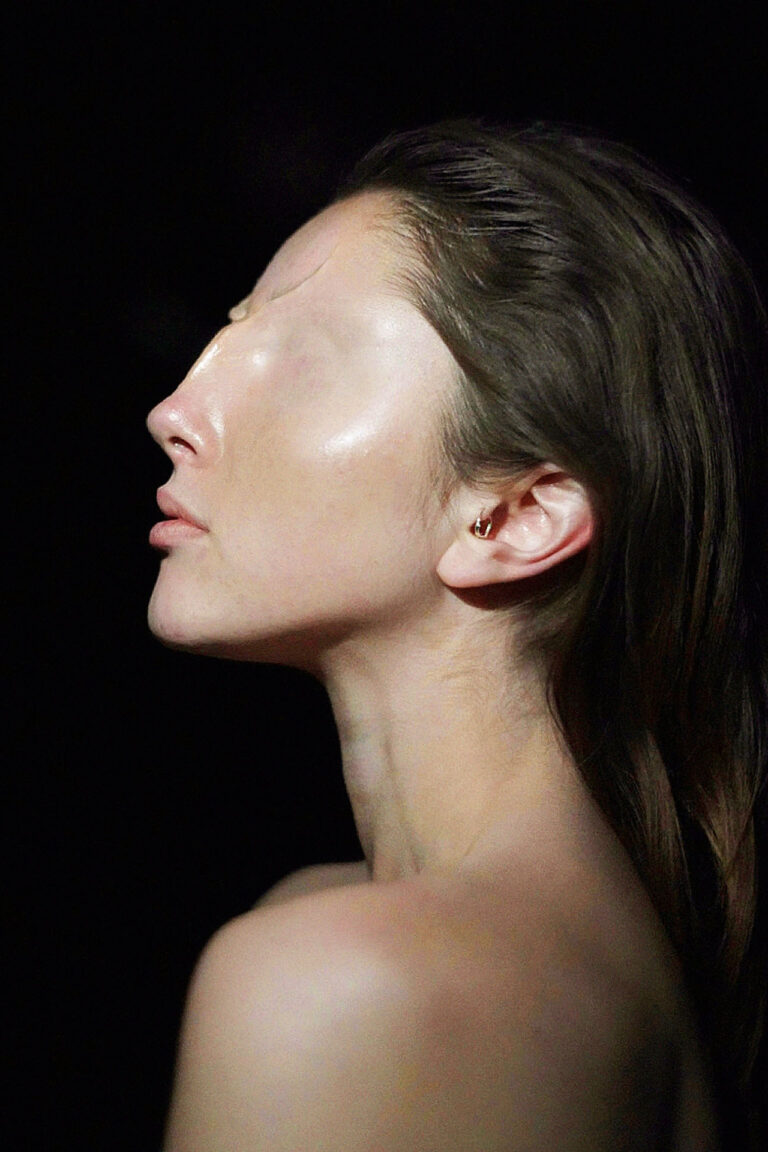 Side profile portrait with no eyes