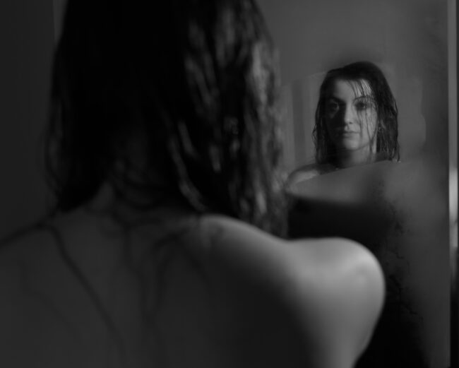 A photograph of me looking into the mirror, contemplating choices in my life this far