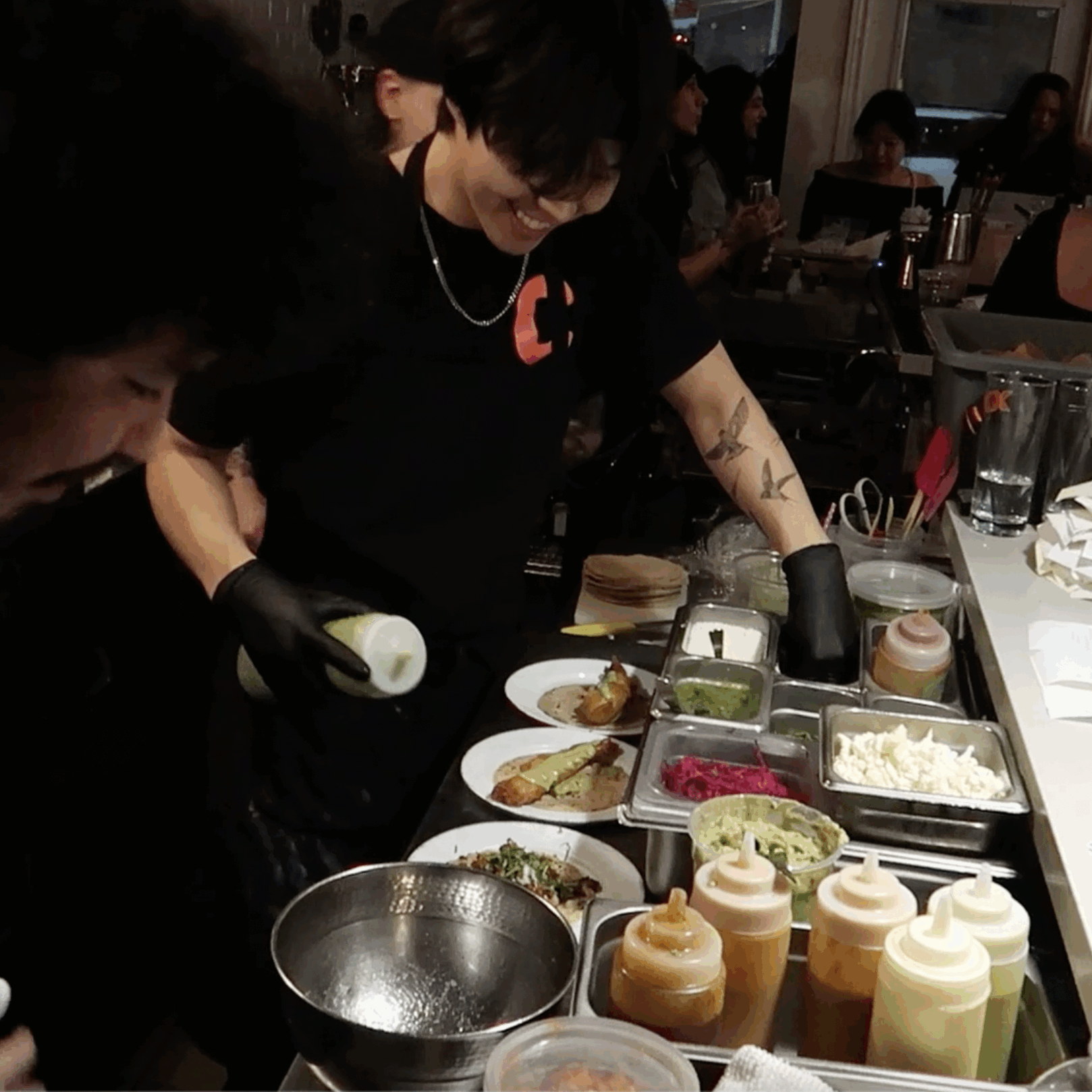 Back of house making food during a dinner rush.