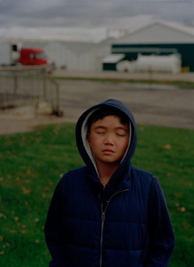 Image of a young boy with his eyes closed